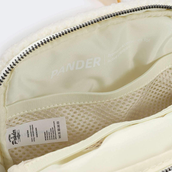 Pander fleece belt bag in Floral White, interior mesh organizer close-up