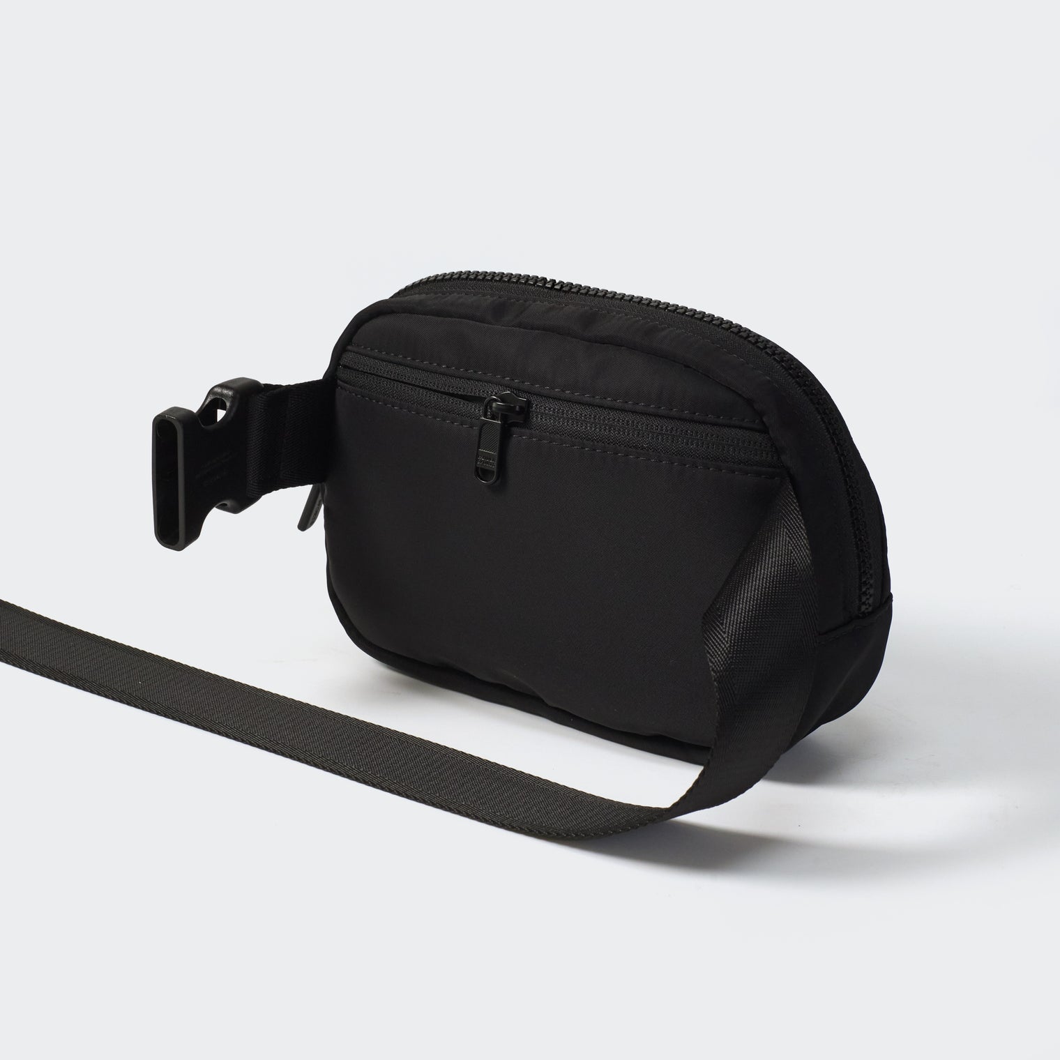 Black belt bag rear view with concealed zipper pocket and adjustable strap