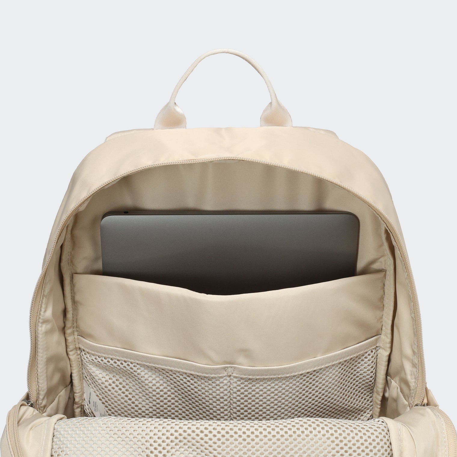 Pander 22L Raw Linen backpack interior tech sleeve and mesh organizer