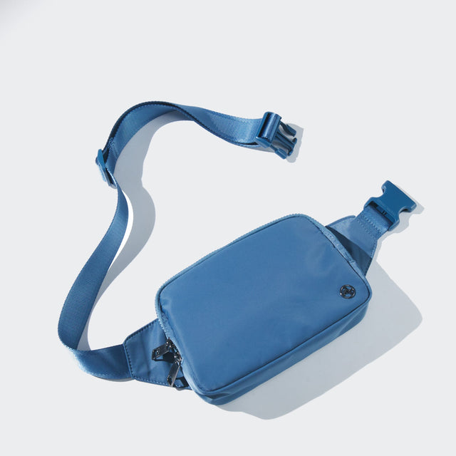 PANDER belt bag in Pale Turquoise, rear zip pocket and buckle detail