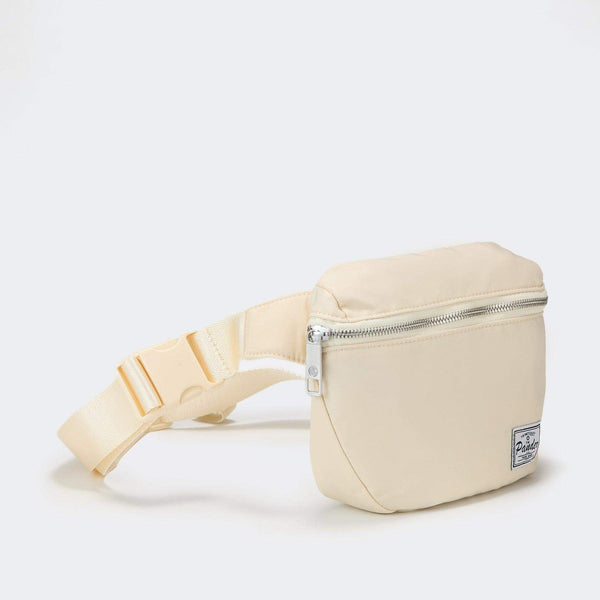 Pander V2 Fifteen 2L waist pack in Natural, three-quarter front view with strap