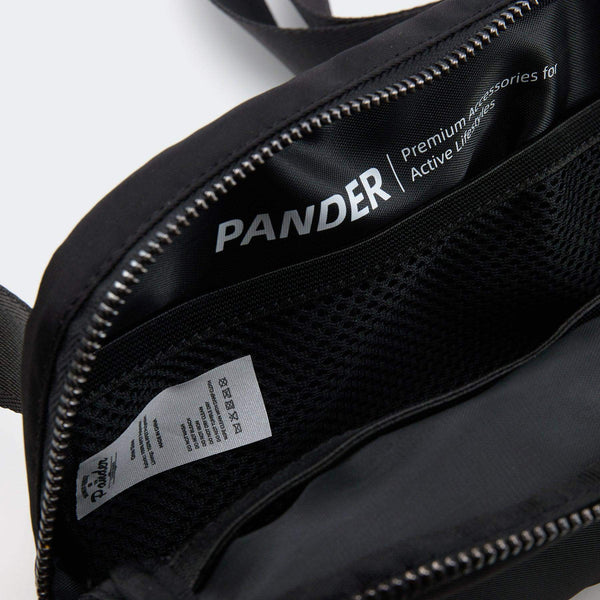 Pander patterned 1L belt bag in Black Floral, open interior pocket layout