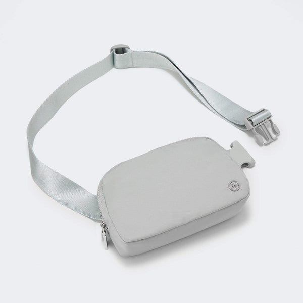 Pander recycled nylon 1L belt bag in Seal Grey, three-quarter front view with strap