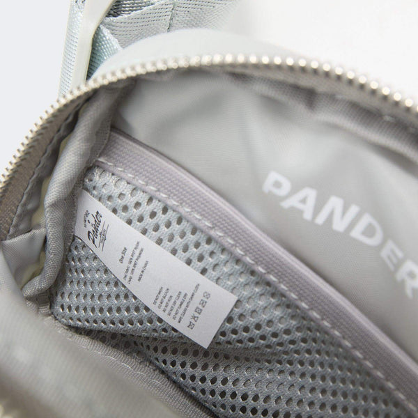 Pander recycled nylon 1L belt bag in Seal Grey, open interior pocket layout