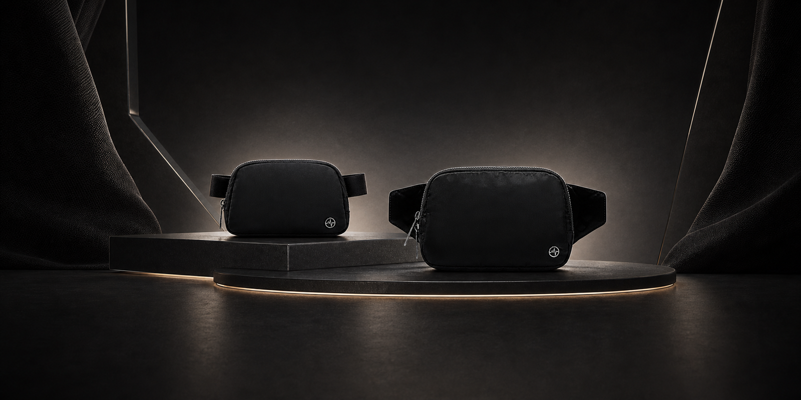 Pander 1L and 2L black belt bags displayed together on a premium dark studio platform