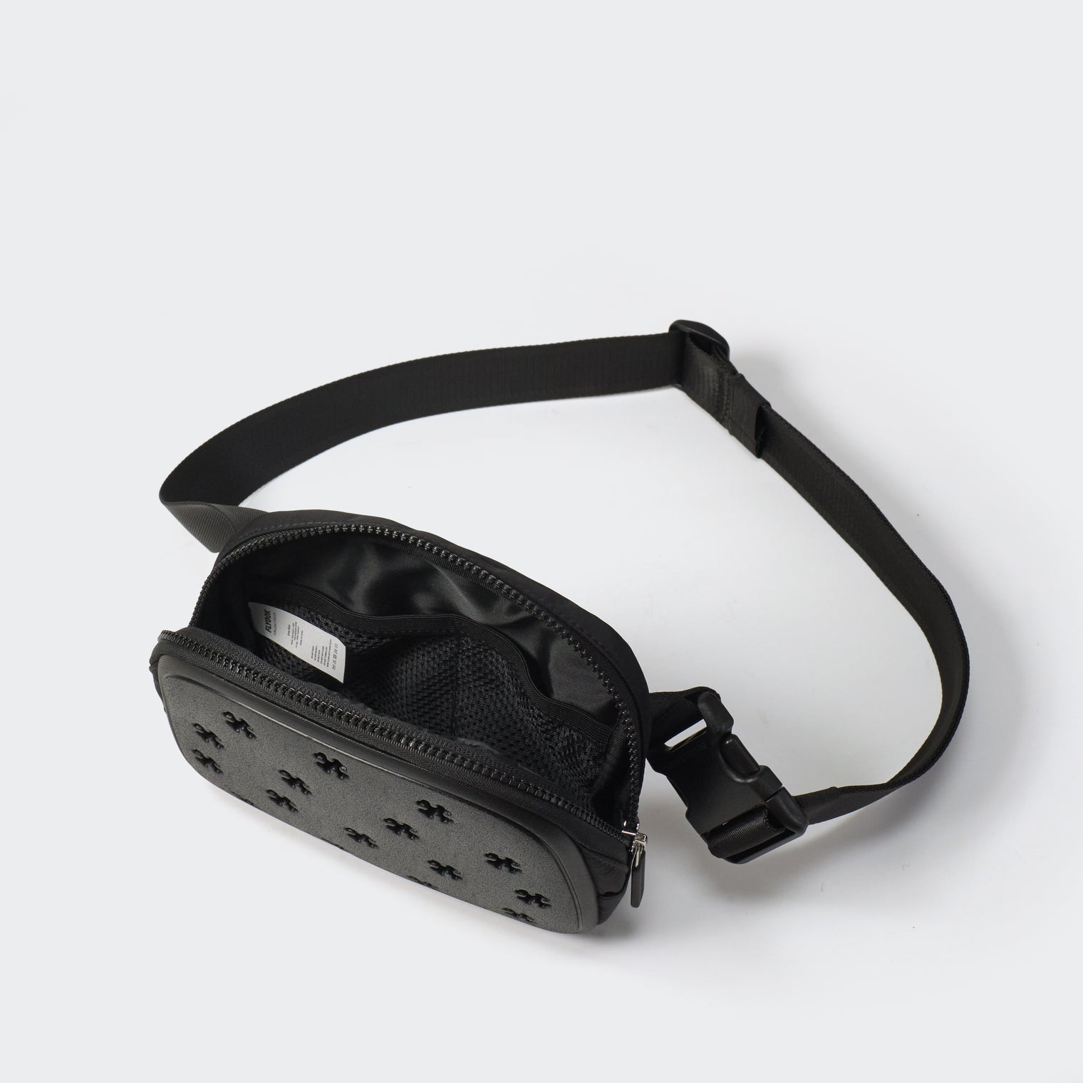 Black molded front belt bag with open main compartment and mesh organization pockets