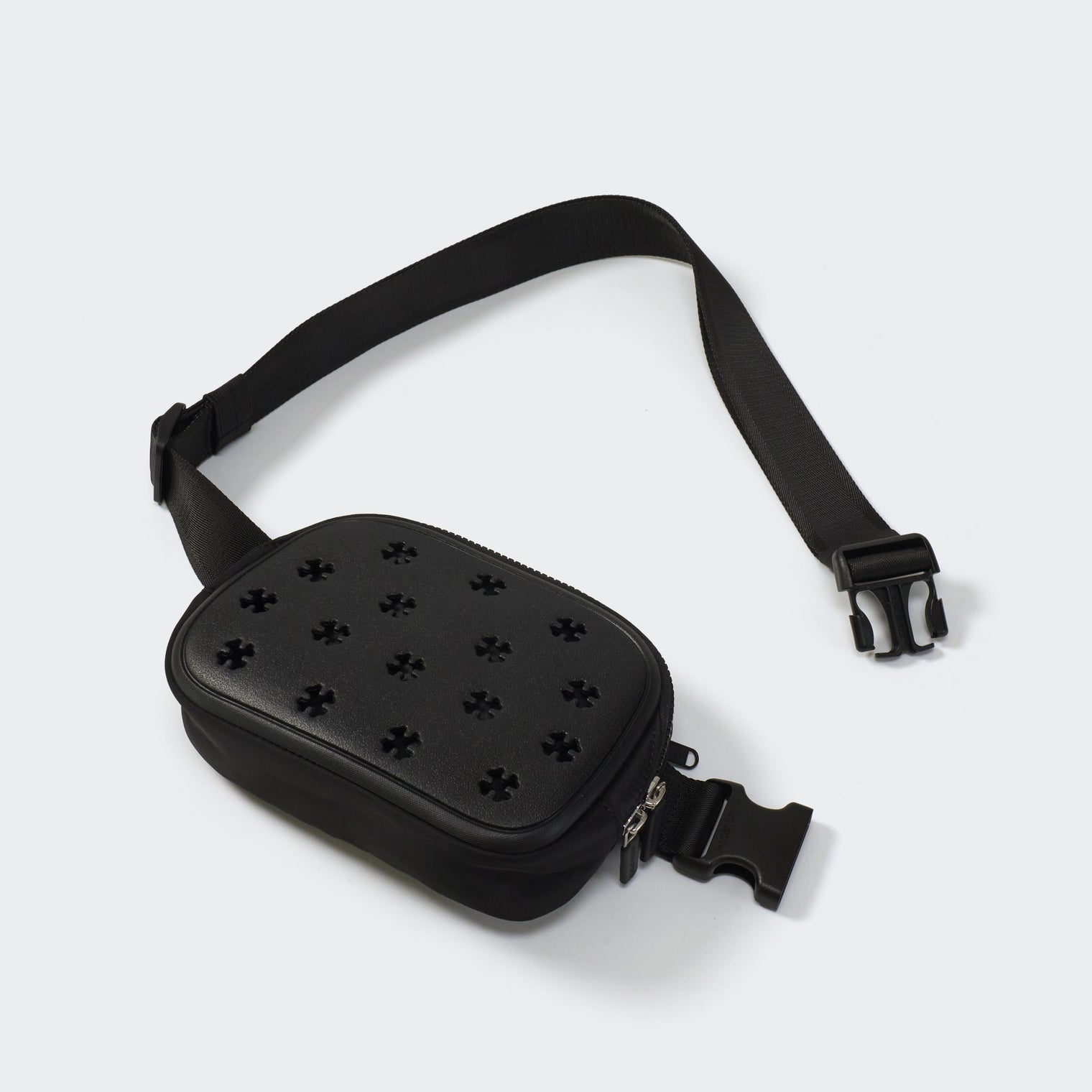 Airflow molded belt bag in Black with adjustable strap, angled front view on #ECEDEF background