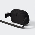 Black belt bag rear view with concealed zipper pocket and adjustable strap