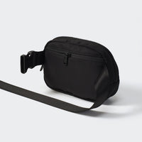 Black belt bag rear view with concealed zipper pocket and adjustable strap
