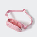 Pink belt bag open to show the soft lining and large mesh organizer pocket