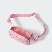 Pink belt bag open to show the soft lining and large mesh organizer pocket