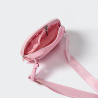 Pink dual-zip belt bag with divided mesh pockets for small essentials