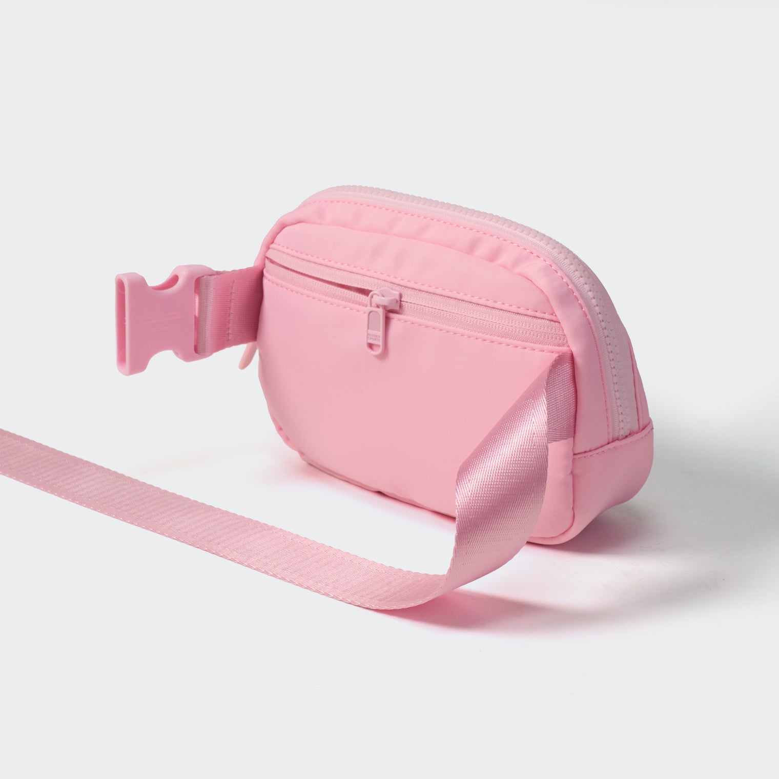 Pink belt bag rear view with secure zip pocket and adjustable webbing