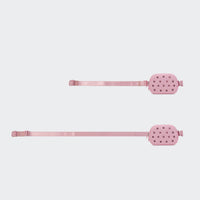 Pink belt bag shown with adjustable webbing at two strap lengths on #ECEDEF background