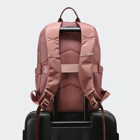 Pander 22L Mauve backpack rear luggage sleeve on suitcase handle