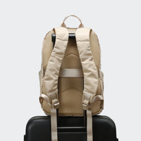 Pander 22L Raw Linen backpack rear luggage sleeve on suitcase handle