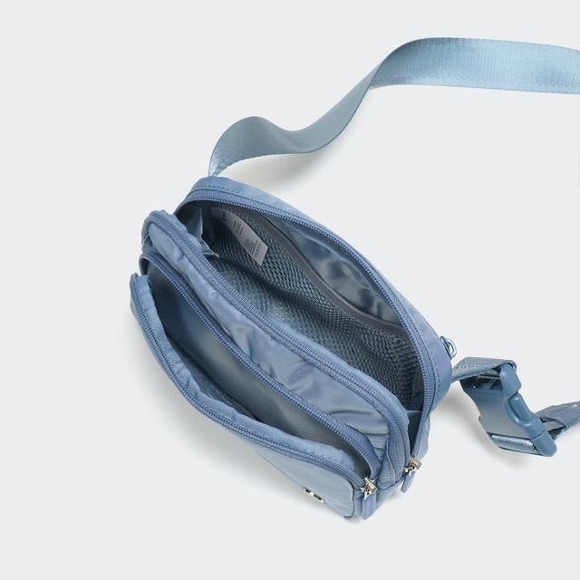 Pander 6-pocket crossbody belt bag in Blue interior