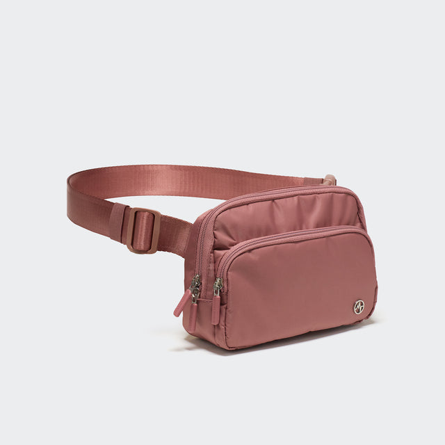 Pander 6-pocket crossbody belt bag in Mauve Pink