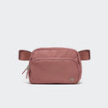 Pander 6-pocket crossbody belt bag in Mauve Pink front view