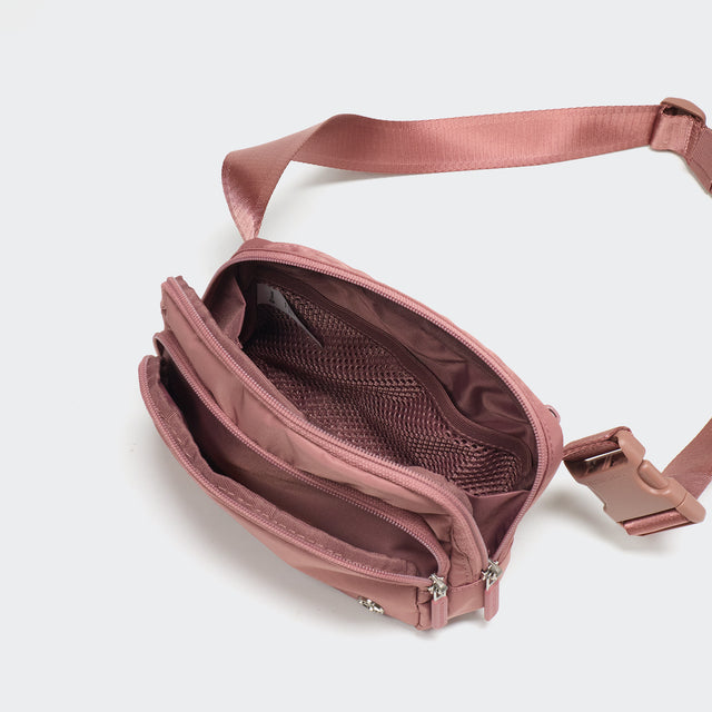 Pander 6-pocket crossbody belt bag in Mauve Pink interior