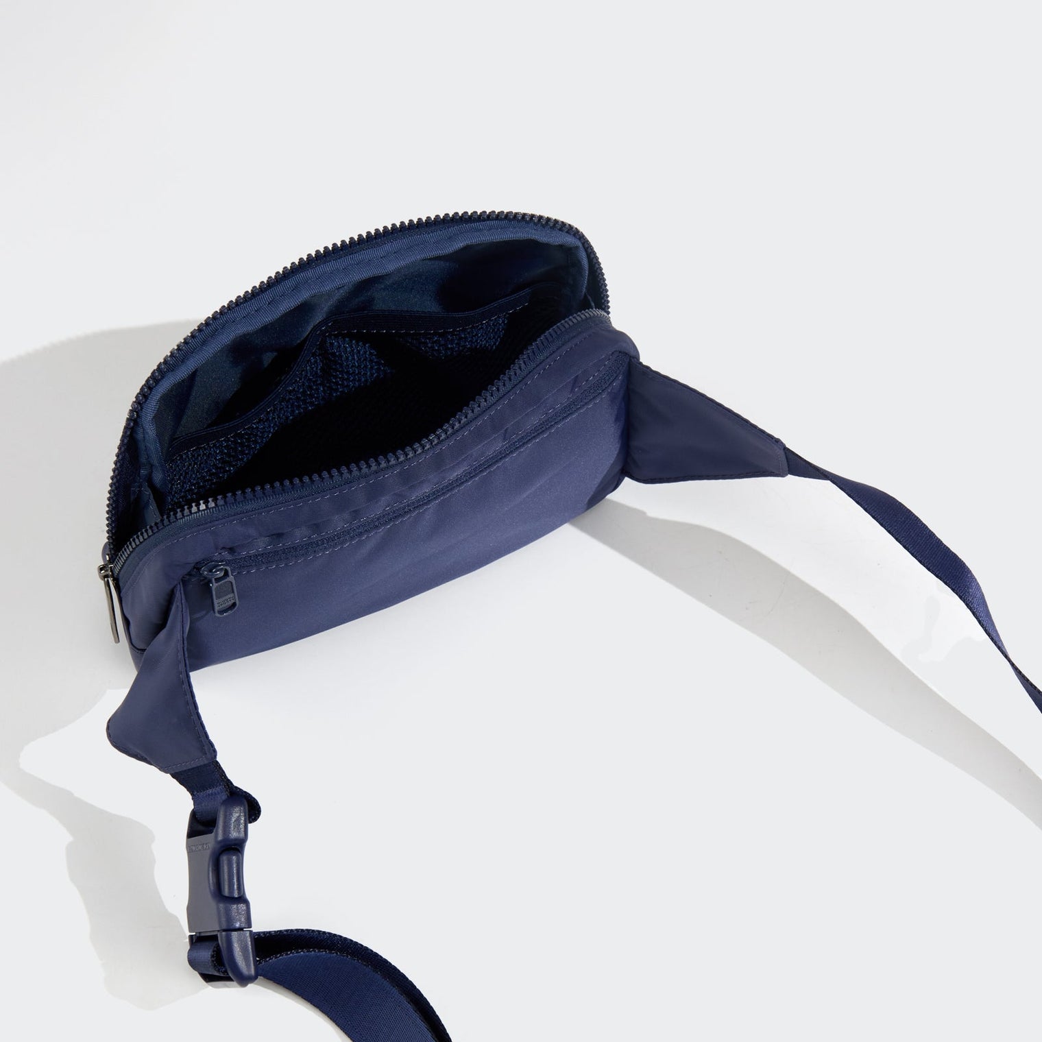 PANDER belt bag in Blue Storm, rear zip pocket and buckle detail