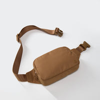 PANDER belt bag in Caramel Brown, rear zip pocket and buckle detail