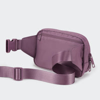 PANDER belt bag in Purple Lavender, rear zip pocket and buckle detail