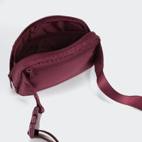 PANDER belt bag in Red Merlot, rear zip pocket and buckle detail